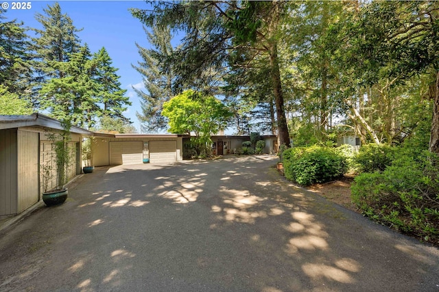 1230 Seagate Ave, Coos Bay, OR 97420 - view of property exterior with driveway and a garage