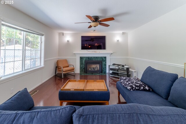 416 Elmar Dr, Winchester, OR 97495 - living room featuring wood finished floors, a high end fireplace, ceiling fan, and baseboards