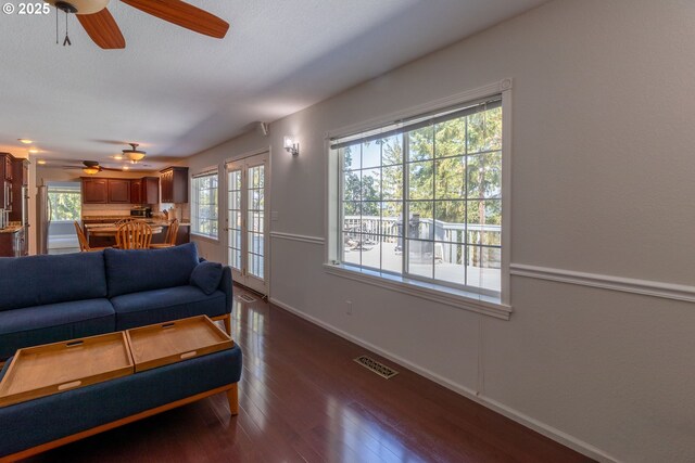 416 Elmar Dr, Winchester, OR 97495 - living area with ceiling fan, healthy amount of natural light, and dark wood-style flooring