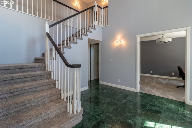 416 Elmar Dr, Winchester, OR 97495 - stairway featuring a high ceiling and baseboards