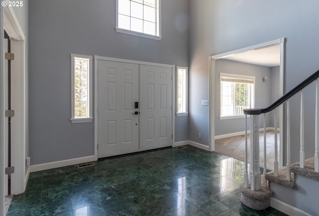 416 Elmar Dr, Winchester, OR 97495 - foyer entrance featuring a towering ceiling, stairs, and baseboards
