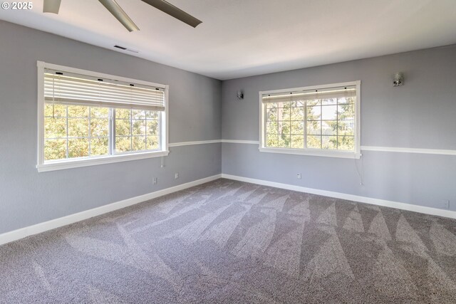 416 Elmar Dr, Winchester, OR 97495 - carpeted empty room featuring healthy amount of natural light, baseboards, and ceiling fan