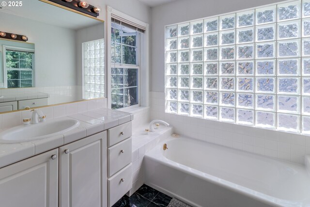 416 Elmar Dr, Winchester, OR 97495 - full bathroom featuring a garden tub, vanity, and plenty of natural light