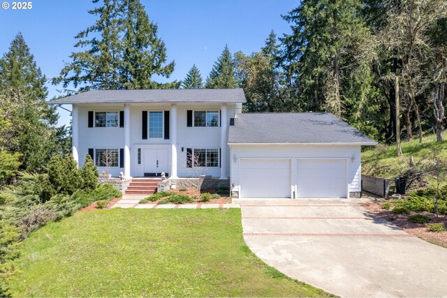 416 Elmar Dr, Winchester, OR 97495 - neoclassical / greek revival house with an attached garage, concrete driveway, a front yard, and roof with shingles