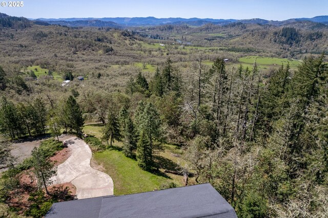 416 Elmar Dr, Winchester, OR 97495 - drone / aerial view of a mountainous background and a forest