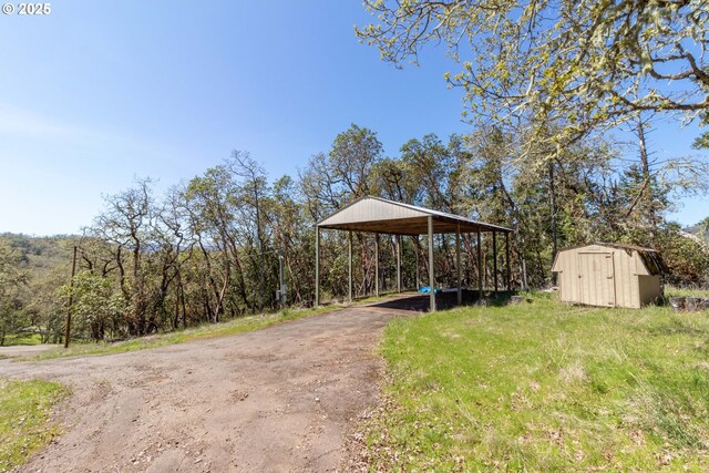 416 Elmar Dr, Winchester, OR 97495 - view of yard featuring a detached carport and asphalt driveway