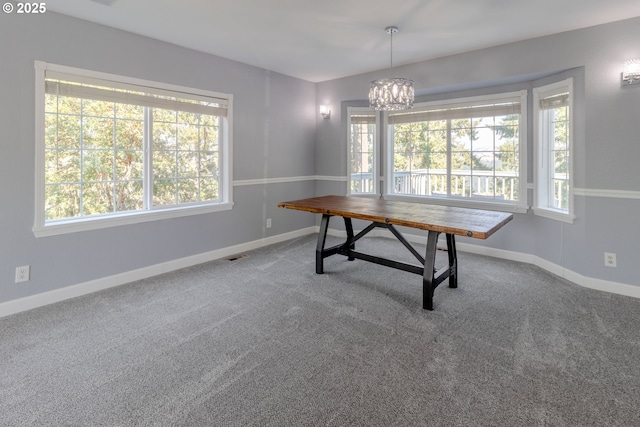 416 Elmar Dr, Winchester, OR 97495 - unfurnished dining area with plenty of natural light, a chandelier, carpet, and baseboards