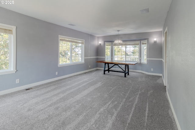 416 Elmar Dr, Winchester, OR 97495 - spare room with carpet, a chandelier, and baseboards