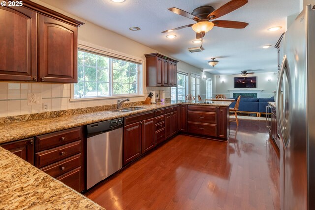 416 Elmar Dr, Winchester, OR 97495 - kitchen featuring appliances with stainless steel finishes, a sink, dark wood-style flooring, a ceiling fan, and open floor plan
