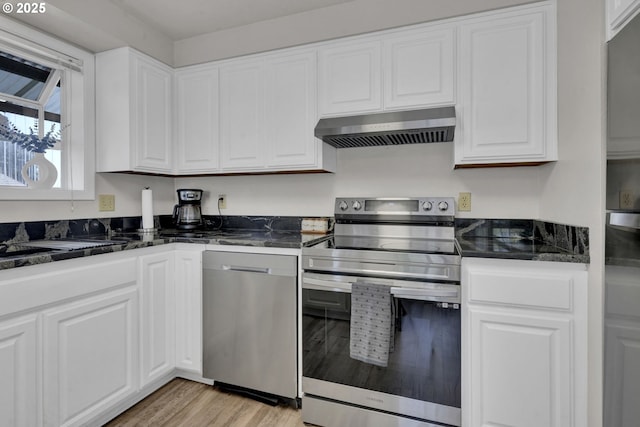 4634 Harriet Ave, Eugene, OR 97402 - kitchen featuring stainless steel appliances, under cabinet range hood, white cabinets, and light wood-type flooring