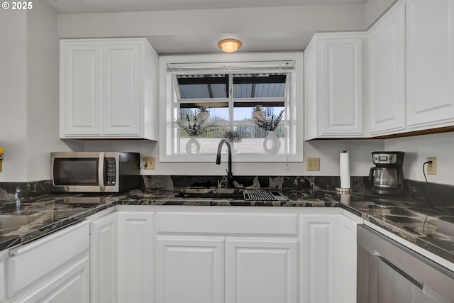 4634 Harriet Ave, Eugene, OR 97402 - kitchen with stainless steel appliances, white cabinets, and dark stone countertops