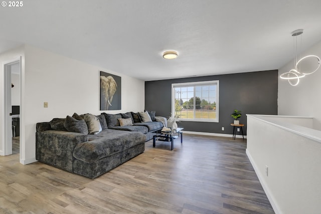 4634 Harriet Ave, Eugene, OR 97402 - living room featuring wood finished floors and a chandelier