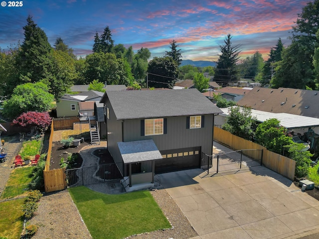 4634 Harriet Ave, Eugene, OR 97402 - view of front facade featuring a gate, an attached garage, a shingled roof, and driveway