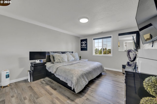 4634 Harriet Ave, Eugene, OR 97402 - bedroom featuring baseboards and wood finished floors