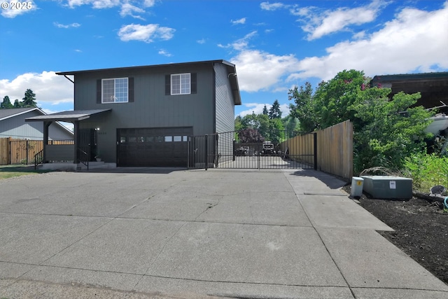 4634 Harriet Ave, Eugene, OR 97402 - view of front of home featuring a gate, concrete driveway, and an attached garage
