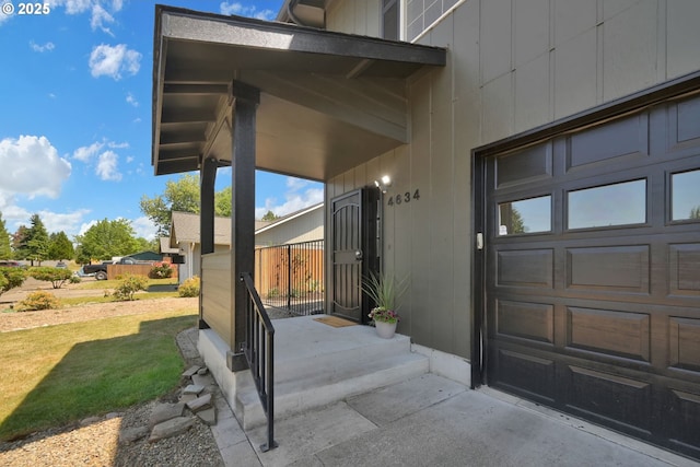 4634 Harriet Ave, Eugene, OR 97402 - view of exterior entry featuring a lawn and a garage