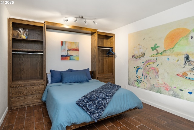 bedroom with wood finish floors