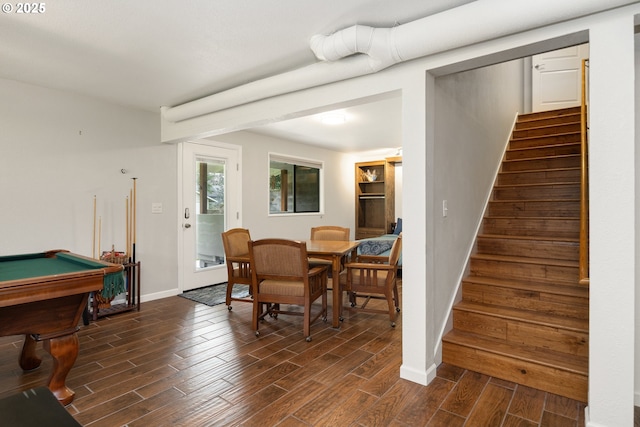 dining area with stairs, baseboards, and wood tiled floor