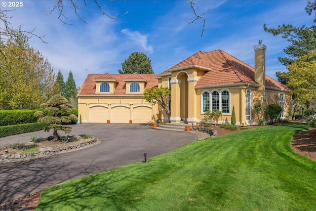 300 SE Arrow Creek Ln, Gresham, OR 97080 - mediterranean / spanish house featuring driveway, a front lawn, an attached garage, and stucco siding