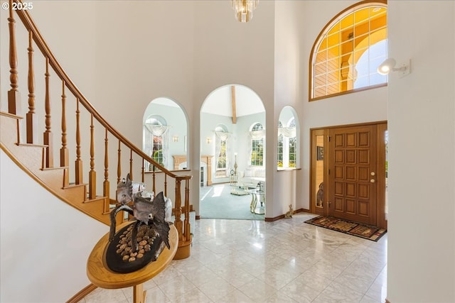 300 SE Arrow Creek Ln, Gresham, OR 97080 - foyer with a high ceiling, stairway, arched walkways, baseboards, and marble finish floors