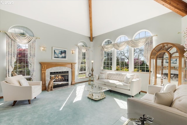 300 SE Arrow Creek Ln, Gresham, OR 97080 - living area featuring beam ceiling, carpet, high vaulted ceiling, a fireplace, and plenty of natural light