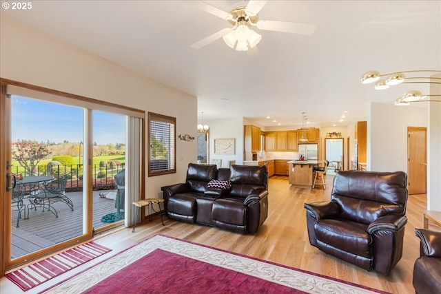 300 SE Arrow Creek Ln, Gresham, OR 97080 - living room with a chandelier, light wood-style floors, and ceiling fan