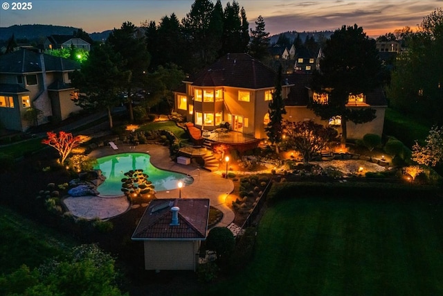 300 SE Arrow Creek Ln, Gresham, OR 97080 - pool at dusk with a patio and an outdoor pool