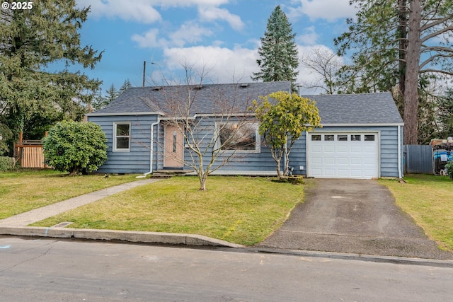 ranch-style house with a garage and a front yard