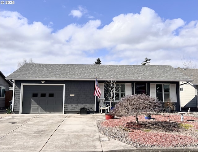 ranch-style house featuring an attached garage, a shingled roof, and concrete driveway