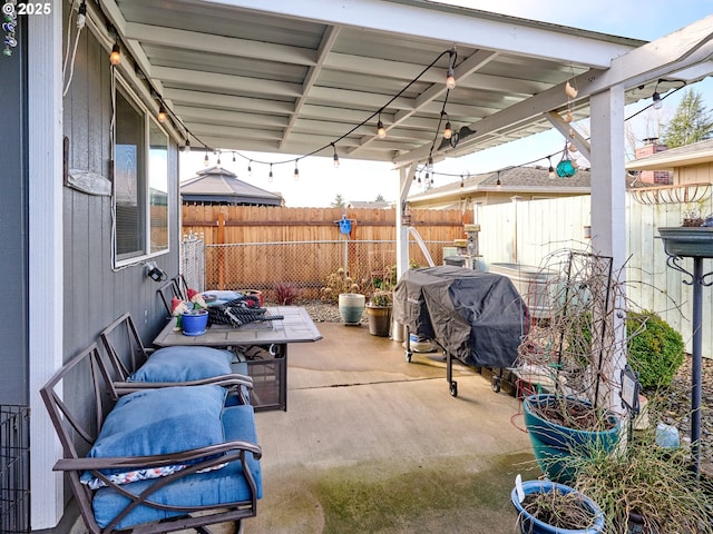 427 E Clackamas Cir, Woodburn, OR 97071 - view of patio / terrace featuring a fenced backyard and a grill