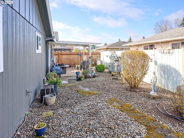 427 E Clackamas Cir, Woodburn, OR 97071 - view of yard with cooling unit, a fenced backyard, and a patio area