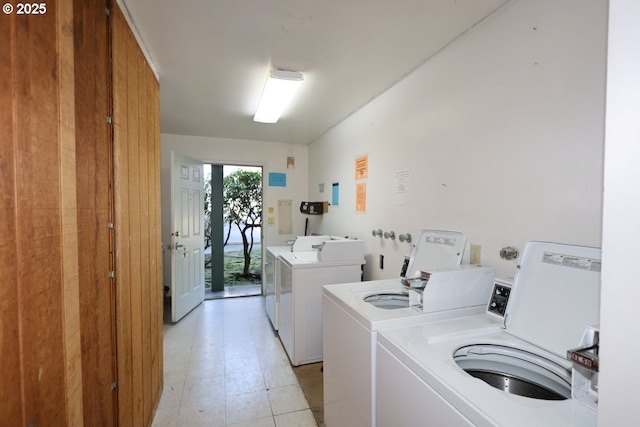 community laundry room featuring washer and clothes dryer