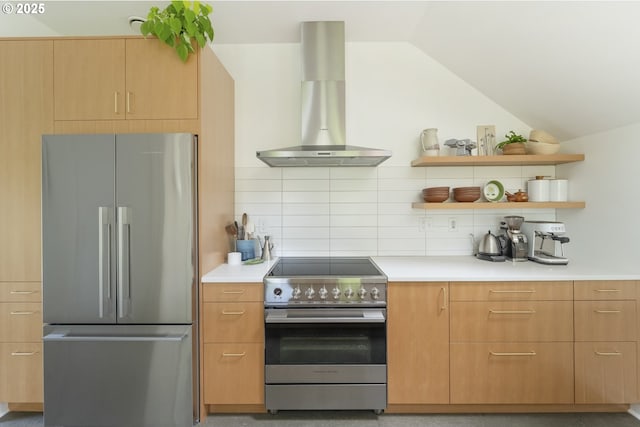 4889 NE Going St, Portland, OR 97218 - kitchen with stainless steel appliances, wall chimney exhaust hood, vaulted ceiling, decorative backsplash, and open shelves