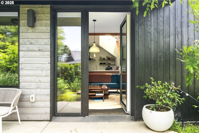 4889 NE Going St, Portland, OR 97218 - doorway featuring concrete floors and wooden walls