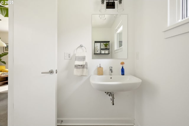 4889 NE Going St, Portland, OR 97218 - bathroom featuring baseboards and a sink