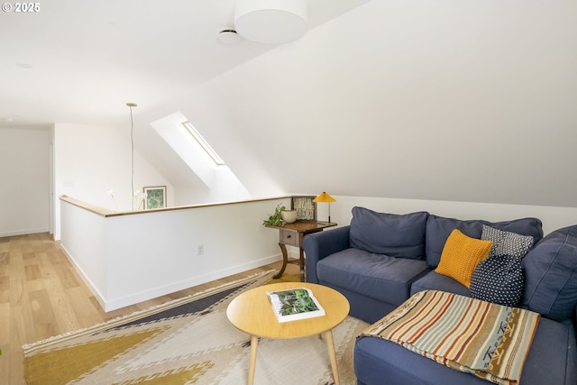 4889 NE Going St, Portland, OR 97218 - living area with light wood-type flooring, a skylight, and vaulted ceiling