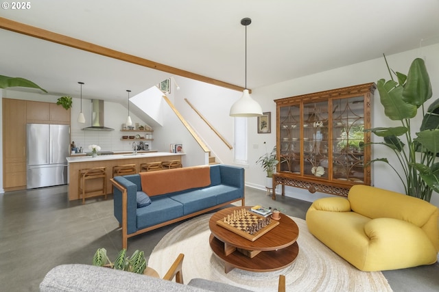 4889 NE Going St, Portland, OR 97218 - living area with concrete floors, lofted ceiling, and stairway