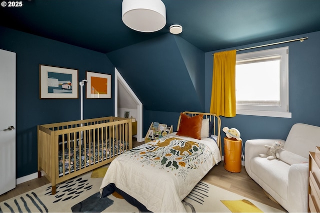 4889 NE Going St, Portland, OR 97218 - bedroom featuring wood finished floors and vaulted ceiling