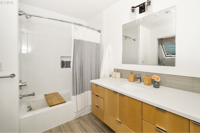 4889 NE Going St, Portland, OR 97218 - full bathroom featuring vanity, shower / tub combo with curtain, tasteful backsplash, and wood finished floors