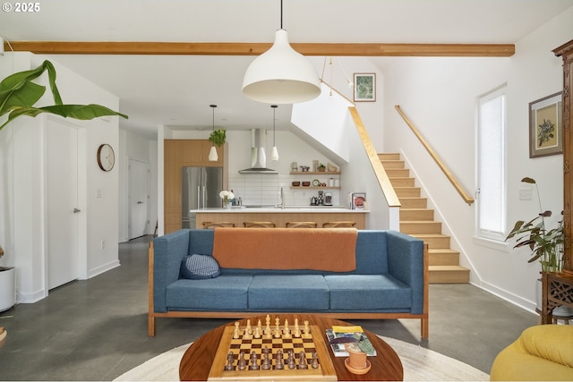 4889 NE Going St, Portland, OR 97218 - living room featuring finished concrete flooring, stairway, and beam ceiling