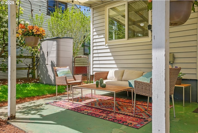 view of patio featuring an outdoor hangout area and fence