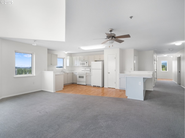 15325 NW Central Dr Unit 301, Portland, OR 97229 - unfurnished living room featuring light colored carpet and a ceiling fan