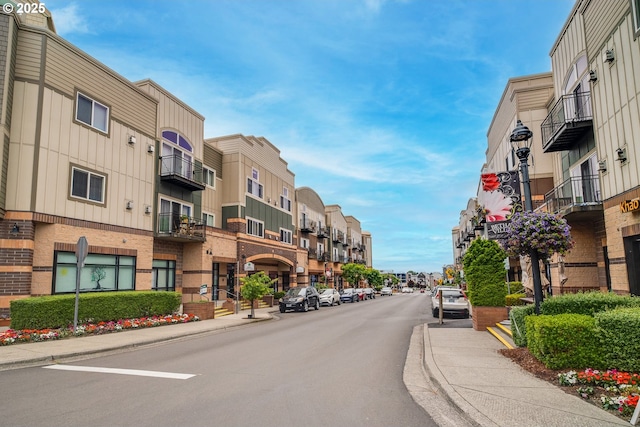 15325 NW Central Dr Unit 301, Portland, OR 97229 - view of asphalt street with sidewalks, curbs, street lighting, and a residential view