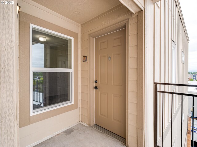 15325 NW Central Dr Unit 301, Portland, OR 97229 - doorway to property with board and batten siding
