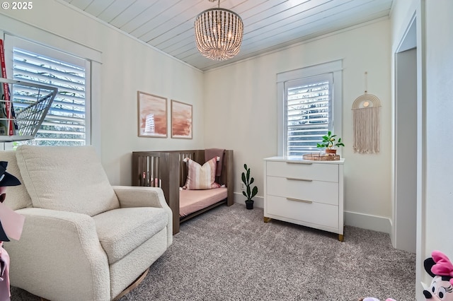 sitting room featuring carpet floors, crown molding, and a wealth of natural light