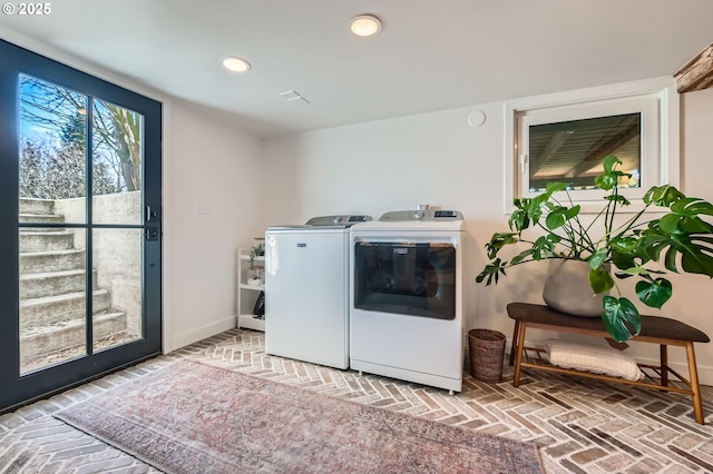 laundry room featuring washer and dryer, laundry area, baseboards, and recessed lighting