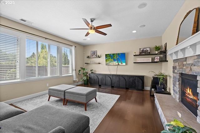 21615 SW Derby Ter, Sherwood, OR 97140 - living room featuring a ceiling fan, baseboards, a fireplace, dark wood-type flooring, and recessed lighting
