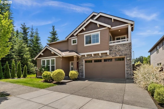 21615 SW Derby Ter, Sherwood, OR 97140 - craftsman-style home with board and batten siding, stone siding, driveway, and an attached garage