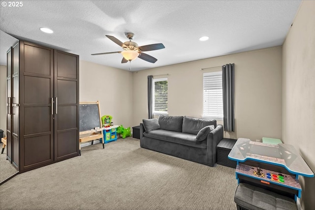 21615 SW Derby Ter, Sherwood, OR 97140 - living area with carpet, ceiling fan, recessed lighting, and a textured ceiling