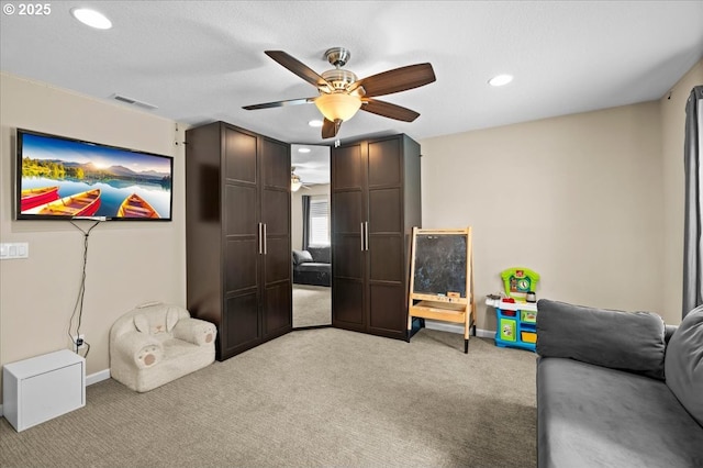 21615 SW Derby Ter, Sherwood, OR 97140 - living area with ceiling fan, light colored carpet, recessed lighting, and baseboards